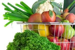 A shopping basket full of fresh produce.